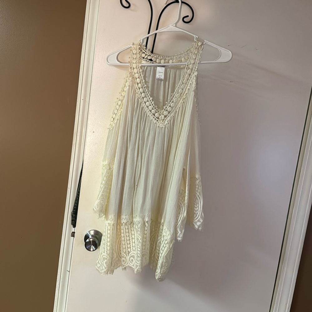Cream lace cold shoulder top.